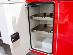 Knapheide Aluminum Combo Body On Ford E Transit NTEA Work Truck Show 2025 Open Vertical Compartment Curb Side