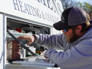 Mommens Heating And Cooling Field Tech Grabbing Wire From KUV Van Compartment
