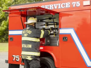 Milford Township Fire Department Rescue Truck Firefighter Grabbing Extraction Gear