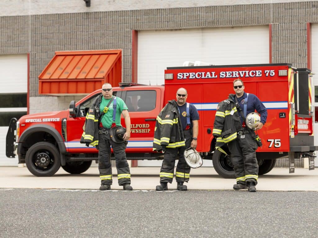 Milford Township Fire Department Rescue Truck Firefighters Pose Near Rescue Truck