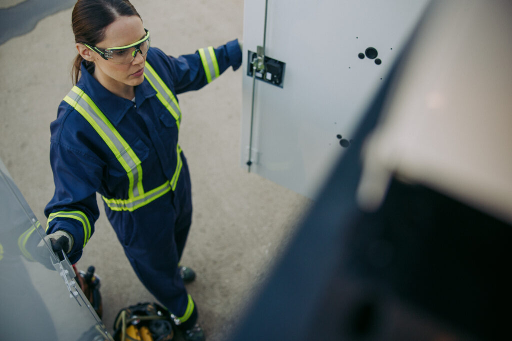 Female Worker Opening Knapheide Mechanics Truck Compartment