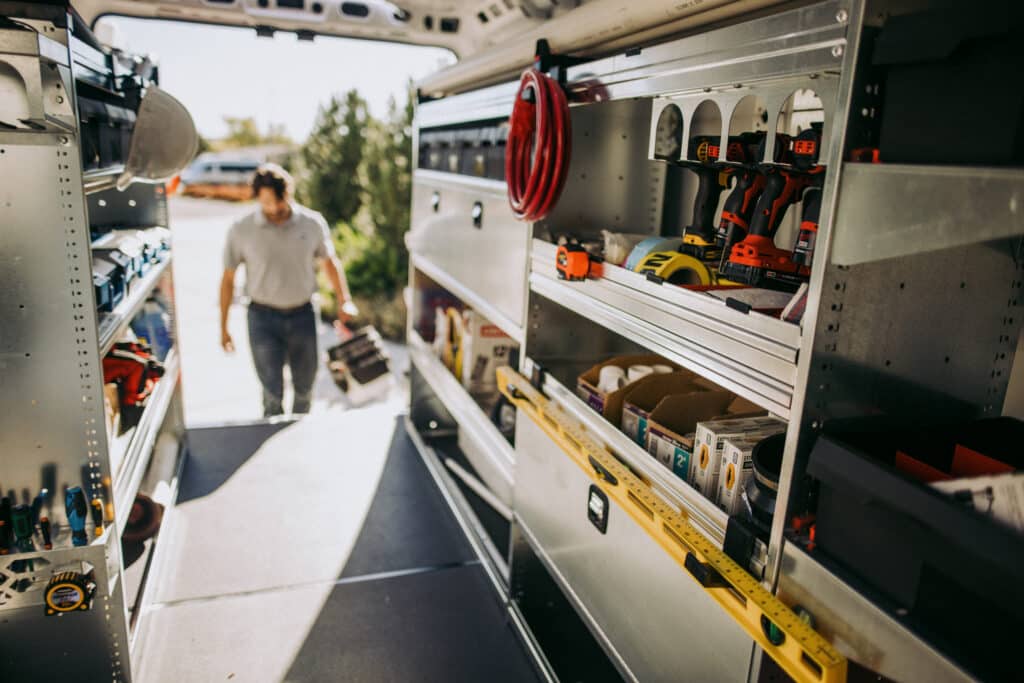 Male Worker Entering Through Rear Doors of Knapheide Upfitted Cargo Van