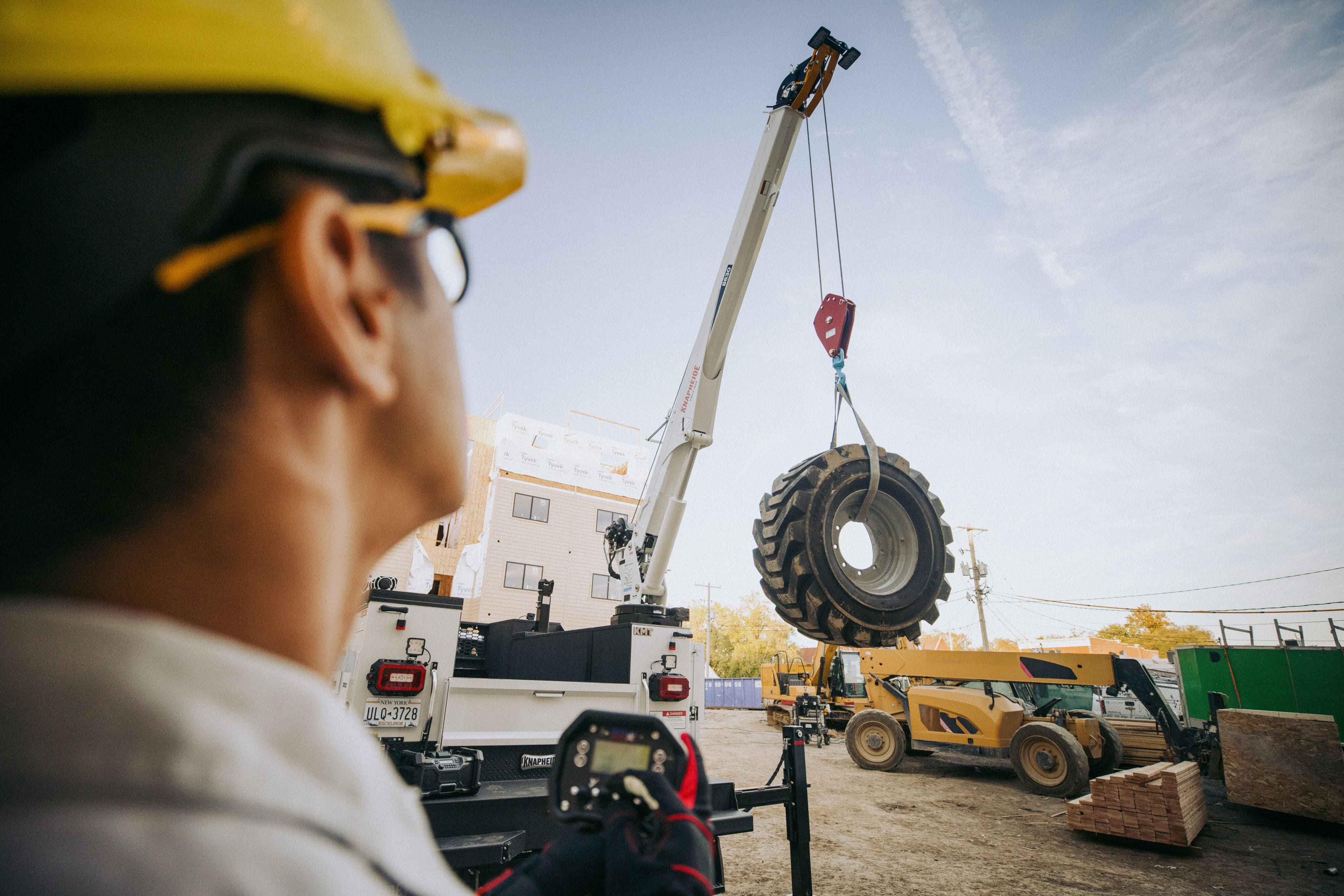 Male Worker Operating Knapheide Mechanic Truck Crane