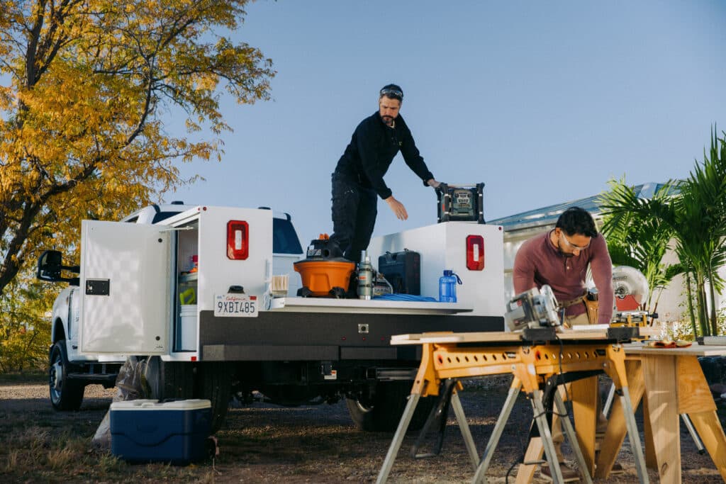 Two Male Workers On Jobsite Alongside Knapheide Service Truck