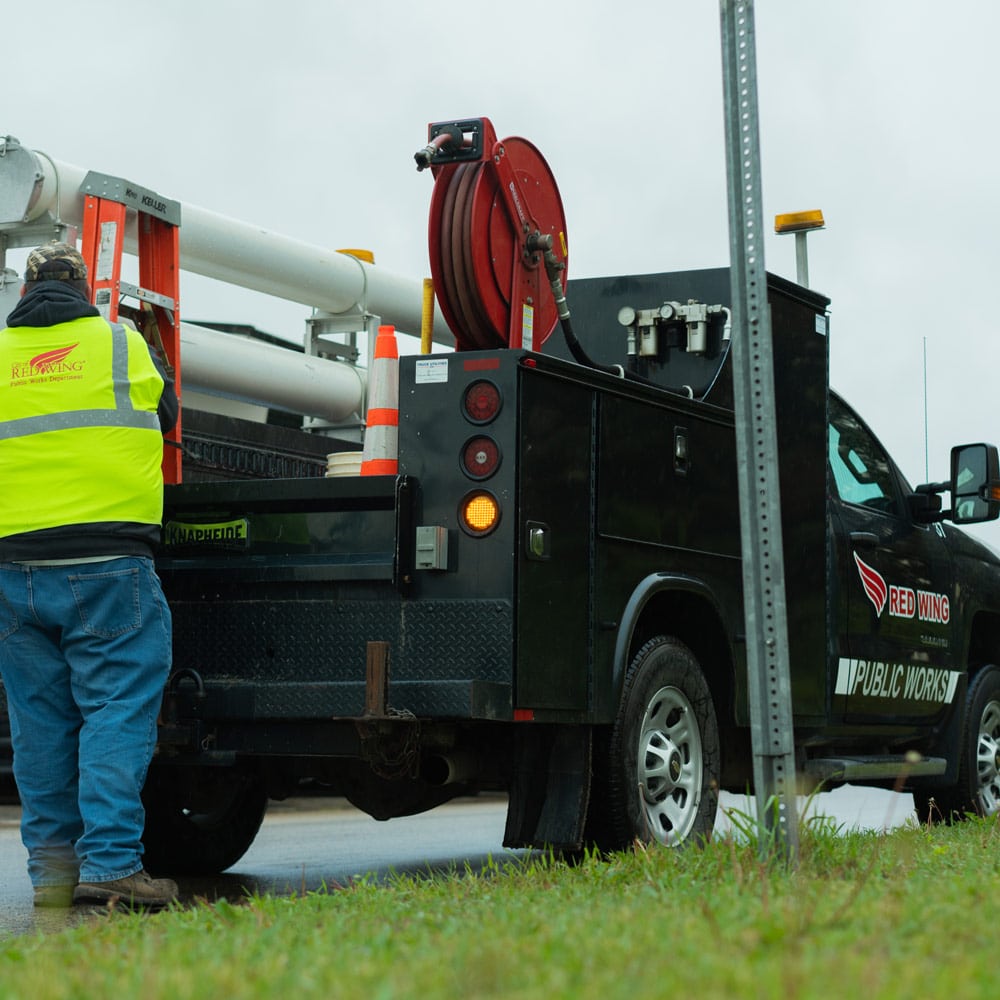 red-wing-utilities-division-worker-and-knapheide-service-truck