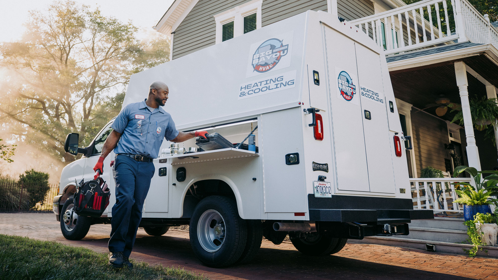 HVAC-Tech-Grabbing-Tools-from-Knapheide-KUV-Van