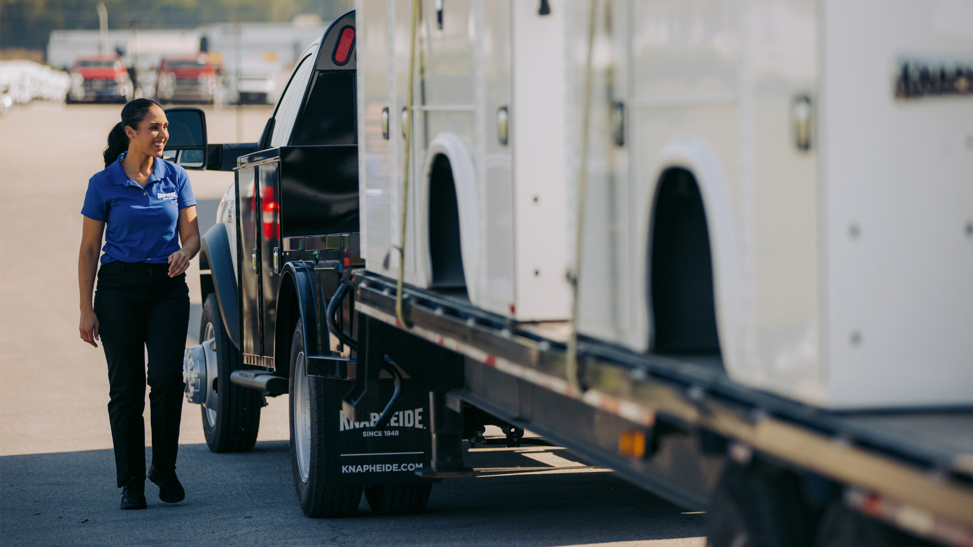 Knapheide-Representative-Standing-Alongside-Truck-Hauling-Knapheide-Truck-Bodies