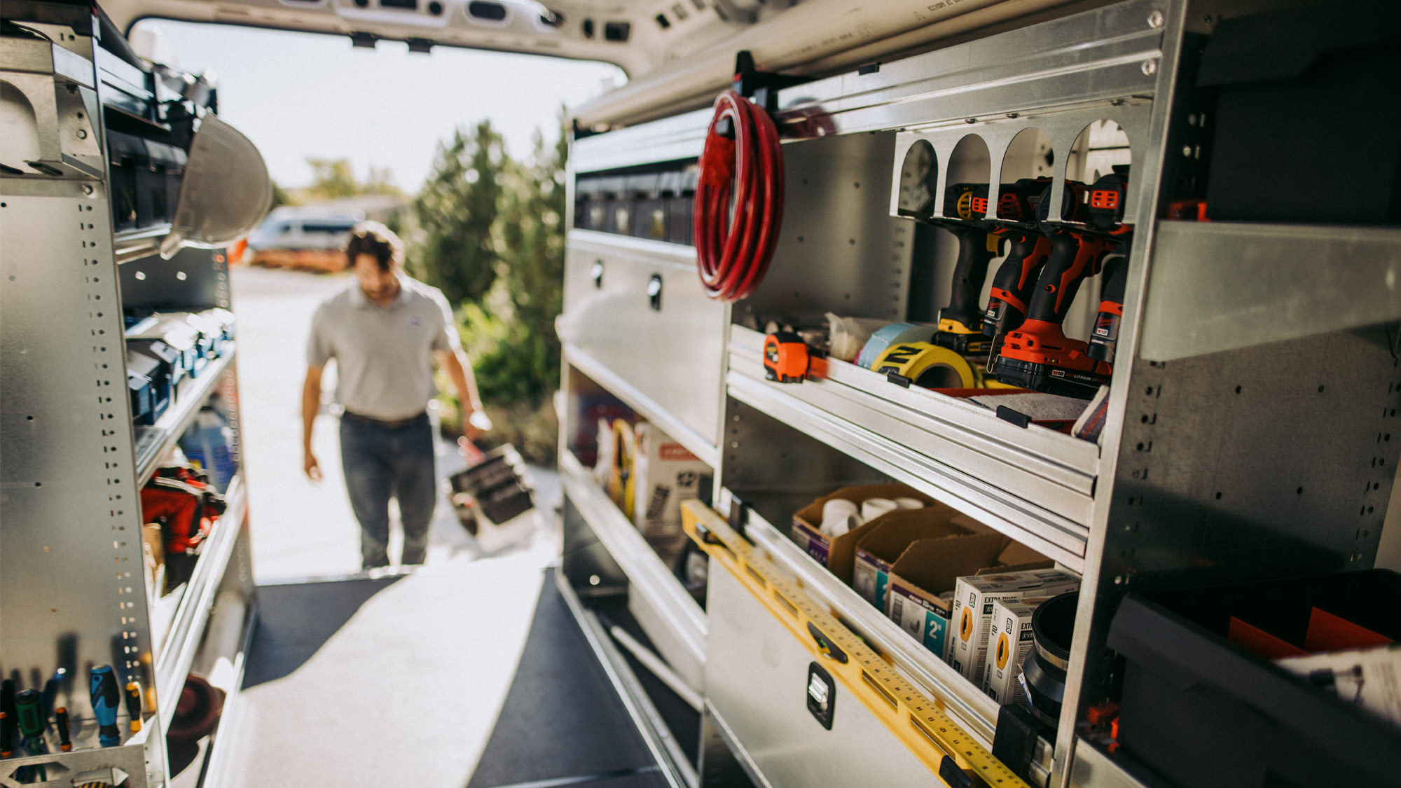 Service-Professional-Entering-Rear-Doors-of-Cargo-Van-Upfit-with-Knapheide-Van-Equipment