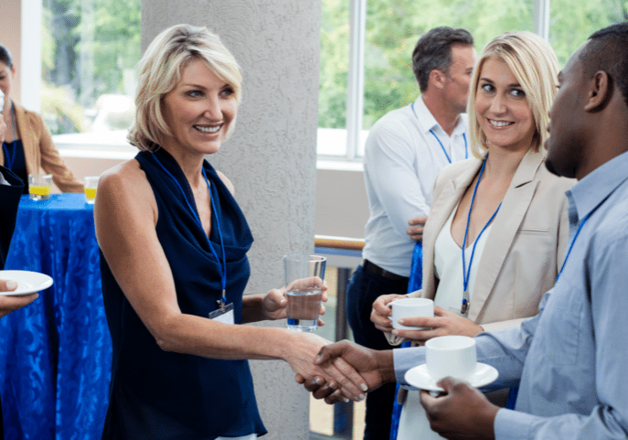 Business Executives Interacting With Each Other While Having Coffee Horizontal