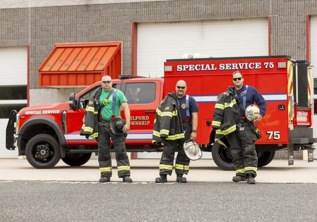 Milford Township Fire Department Rescue Truck Firefighters Pose Near Rescue Truck